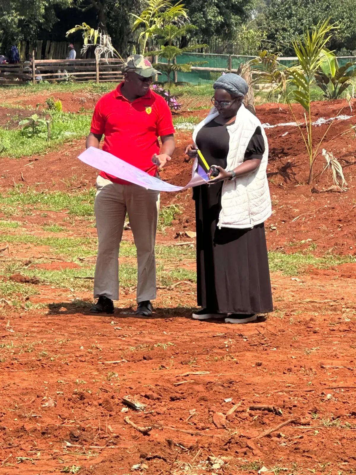 People reviewing plans on site at Kamoiywo Springs